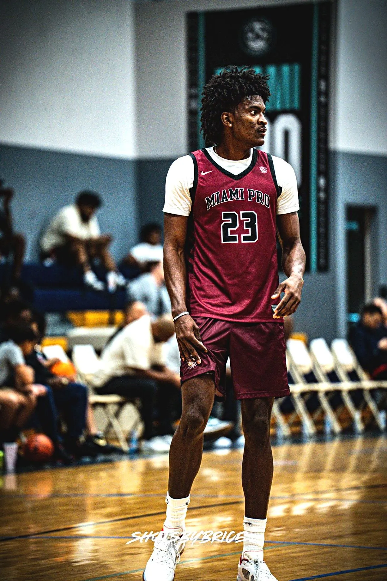 Kaleb Myers walking on the court in a Miami Pro uniform